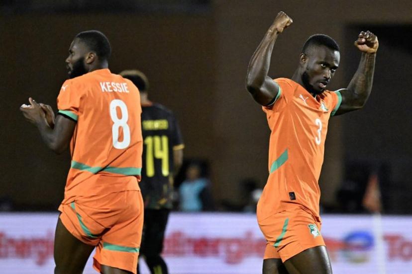 Ivory Coast's defender #03 Ghislain Konan (R) celebrates the goal of Ivory Coast's forward #15 Amad Diallo (not pictured) during the Africa Cup of Nations (CAN) Group F football match between Ivory Coast and Cameroon at Marrakesh Stadium in Marrakesh on December 28, 2025.   Khaled DESOUKI / AFP