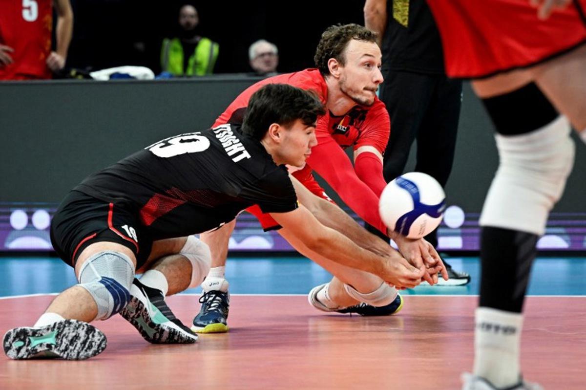 Belgium's Gorik Lantsoght (L) and Sam Deroo pass the ball during the Men's EuroVolley 2026 Pool C match Serbia vs Belgium in Tampere, on September 17, 2026.  Team Belgium won the match. Emmi Korhonen / Lehtikuva / AFP
