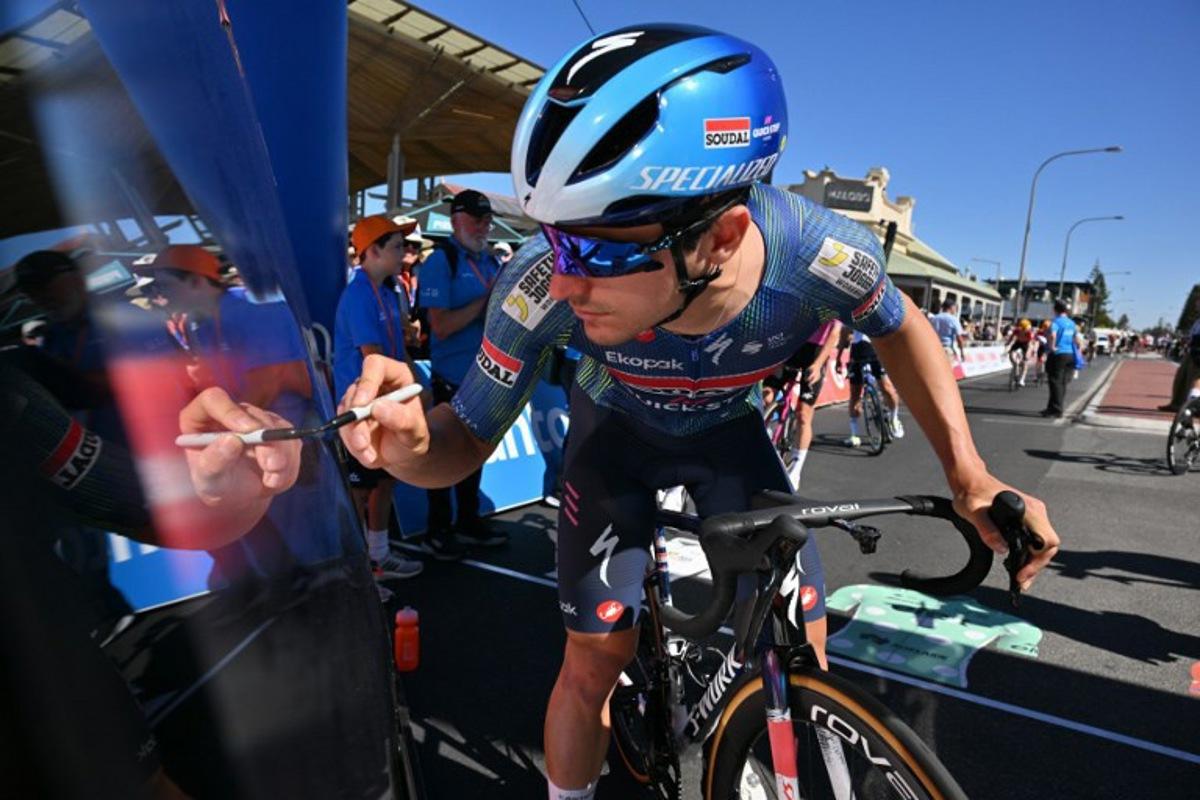 SoudalÐQuick-Step rider Andrea Raccagni Noviero of Italy signs on prior to the start of stage three of the Tour Down Under UCI Men's Cycling race in Adelaide on January 23, 2026.  Brenton Edwards / AFP