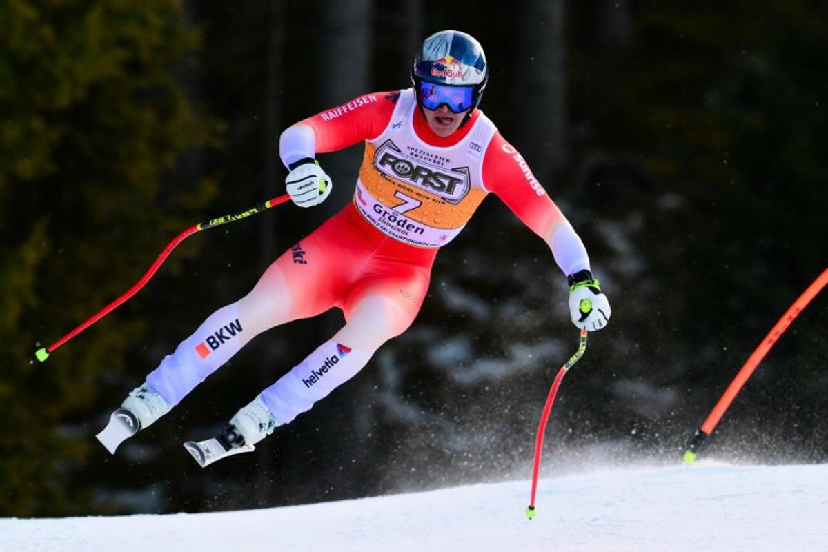 Switzerland's Franjo Von Allmen competes in the men's downhill race part of the FIS Alpine Ski World Cup 2025-2026, in Val Garderna, northern Italy, on December 20, 2025.  Stefano RELLANDINI / AFP