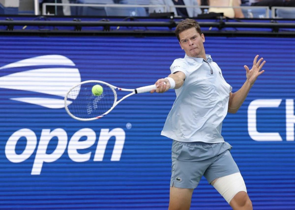 Belgium's Alexander Blockx plays a shot to Argentina's Francisco Cerundolo during their men's singles round of 16 tennis match on day nine of the US Open tennis tournament at the USTA Billie Jean King National Tennis Center in New York on September 7, 2026.  KENA BETANCUR / AFP