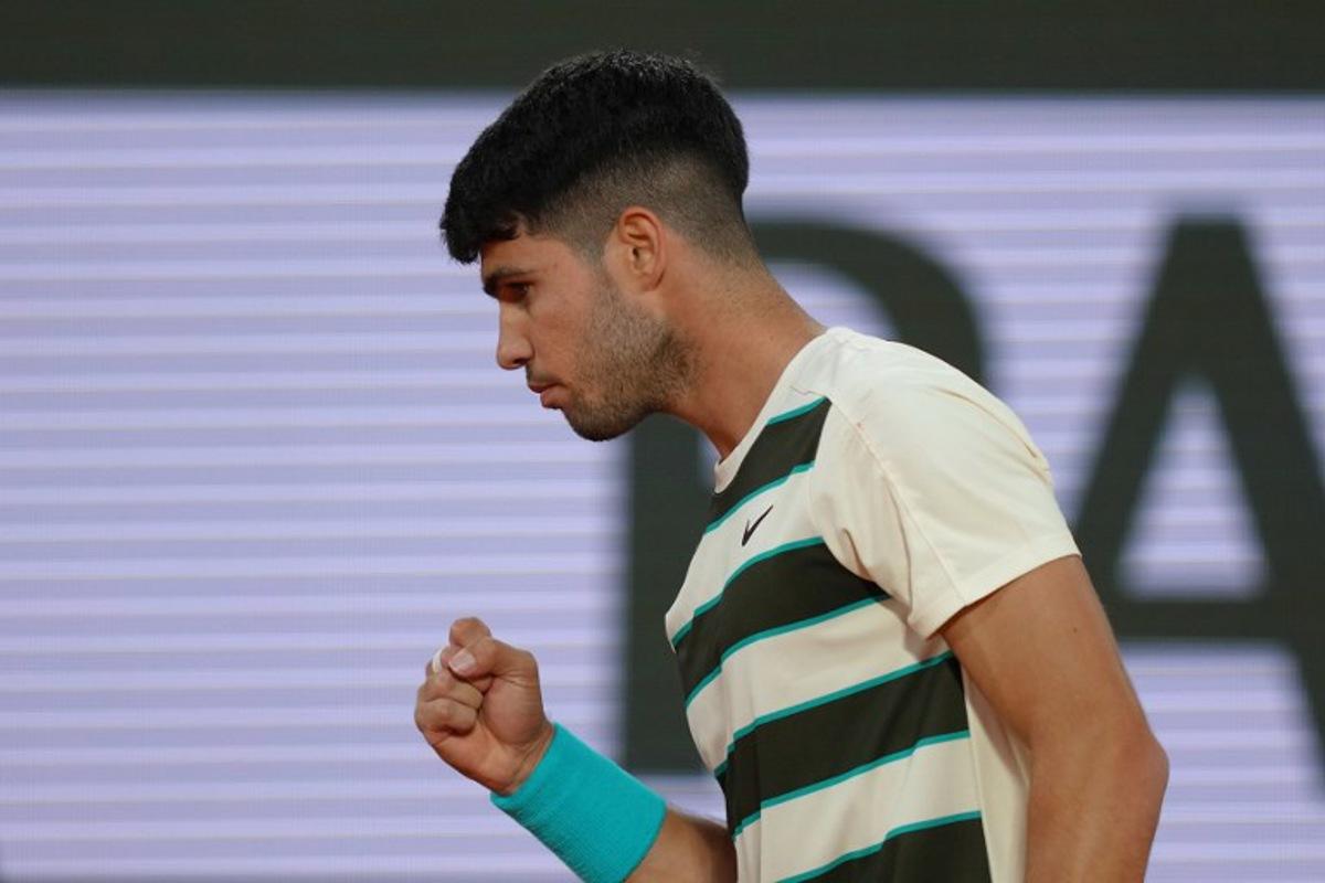 Spain's Carlos Alcaraz reacts to a point against US Tommy Paul during their quarter-final men's singles match on day 10 of the French Open tennis tournament on Court Philippe-Chatrier at the Roland-Garros Complex in Paris on June 3, 2025.  Dimitar DILKOFF / AFP