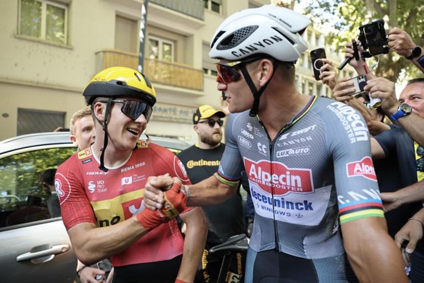 Alpecin - Deceuninck team's Dutch rider Mathieu van der Poel (R) congratulates Uno-X Mobility team's Norwegian rider Jonas Abrahamsen (L) as he celebrates after winning the 11th stage of the 112th edition of the Tour de France cycling race, 156.8 km starting and finishing in Toulouse, southwestern France, on July 16, 2025.  christophe petit tesson / POOL / AFP
