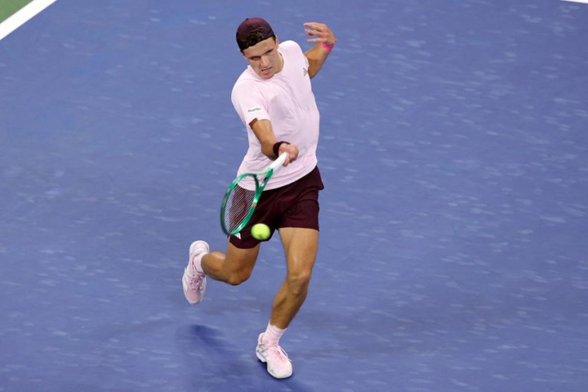 Czech Republic's Jakub Mensik hits a return to USA's Learner Tien during their men's singles third round tennis match on day seven of the US Open tennis tournament at the USTA Billie Jean King National Tennis Center in New York City on September 5, 2026.  KENA BETANCUR / AFP