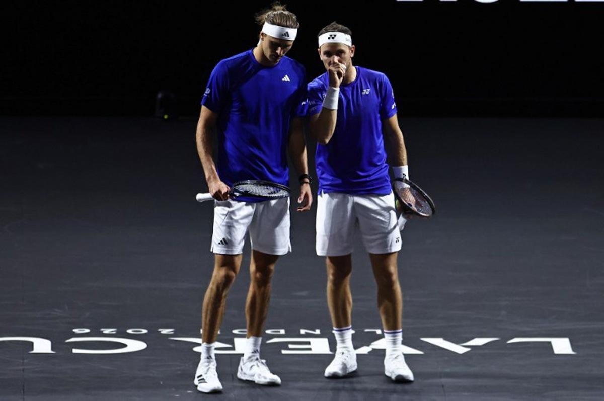 Germany's Alexander Zverev playing with Norway's Casper Ruud for Team Europe look on whilst against USA's Brandon Nakashima and Kazakhstan's Alexander Bublik of Team World during their 2026 Laver Cup men's doubles tennis match, at the O2 Arena in London on September 26, 2026.  Henry Nicholls / AFP
