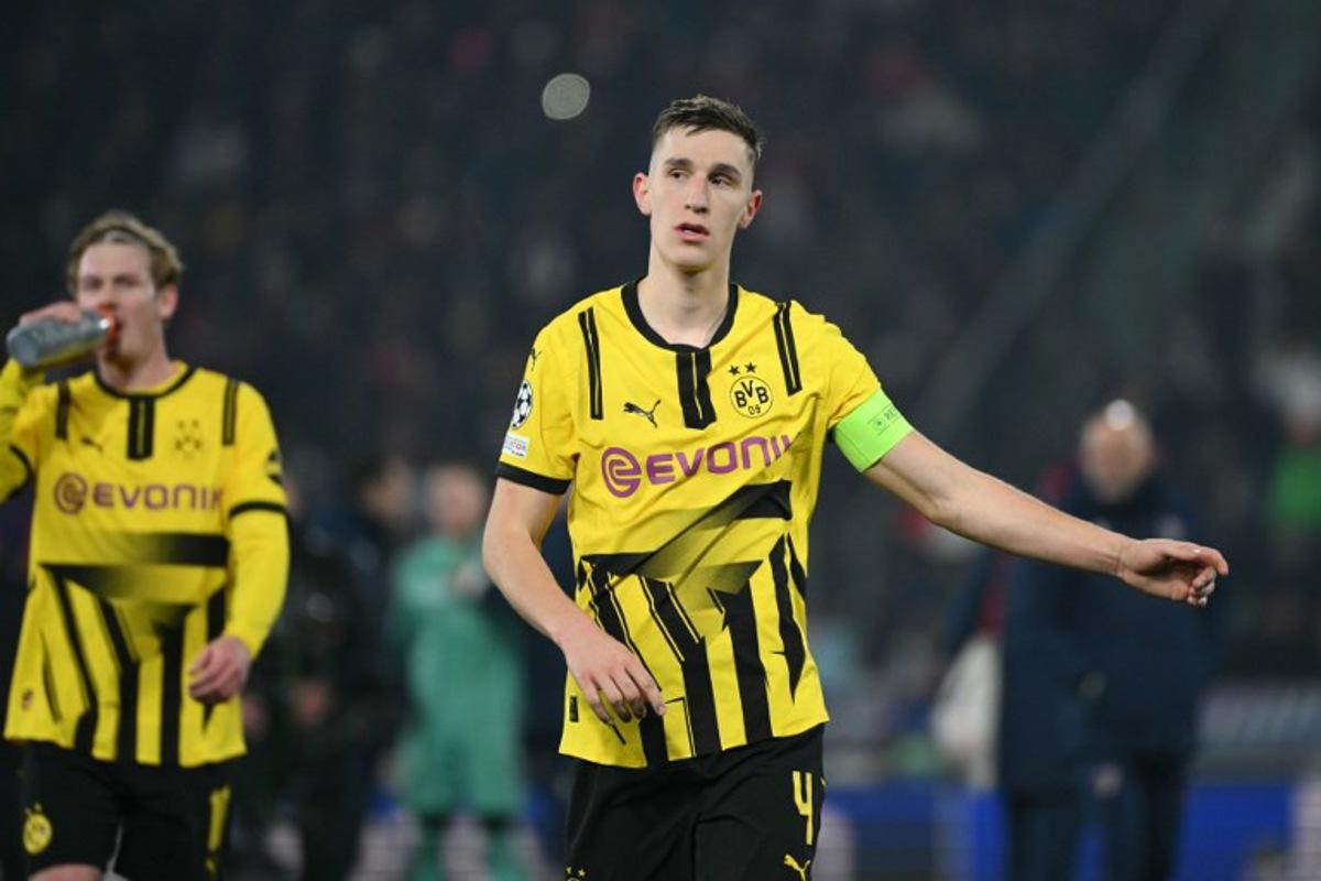 Dortmund's German defender #04 Nico Schlotterbeck looks dejected after being defeated in the UEFA Champions League football match between Bologna and Borussia Dortmund at the Renato Dall'Ara stadium in Bologna on January 21, 2025.  Alberto PIZZOLI / AFP