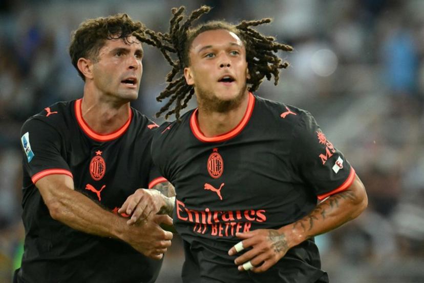 AC Milan's Belgian midfielder #22 Diego Moreira (R) celebrates after scoring Milan's second goal during the Italian Serie A football match between Lazio and AC Milan at the Olympic Stadium in Rome on September 12, 2026.  Alberto PIZZOLI / AFP