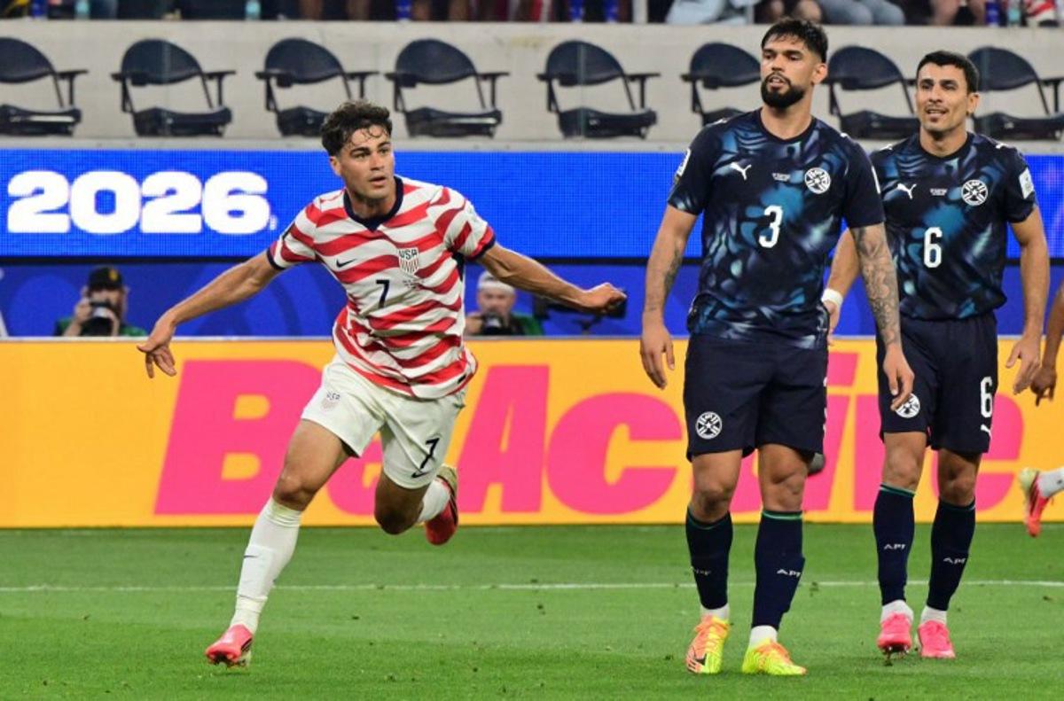 US midfielder #07 Giovanni Reyna celebrates scoring his team's fourth goal during the 2026 World Cup Group D football match between USA and Paraguay at the Los Angeles Stadium in Inglewood on June 12, 2026.  Frederic J. BROWN / AFP