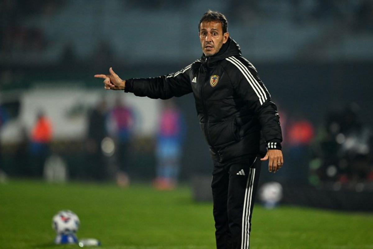 Venezuela's Argentine head coach Fernando Batista gestures during the 2026 FIFA World Cup South American qualifiers football match between Uruguay and Venezuela at the Centenario stadium in Montevideo on June 10, 2025.  Eitan ABRAMOVICH / AFP