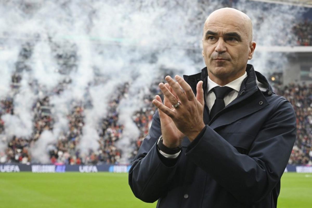 Portugal's Spanish coach Roberto Martinez claps before the 2026 World Cup qualifiers Europe zone group F football match between Portugal and Armenia, at Dragao stadium in Porto on November 16, 2025.   Miguel RIOPA / AFP
