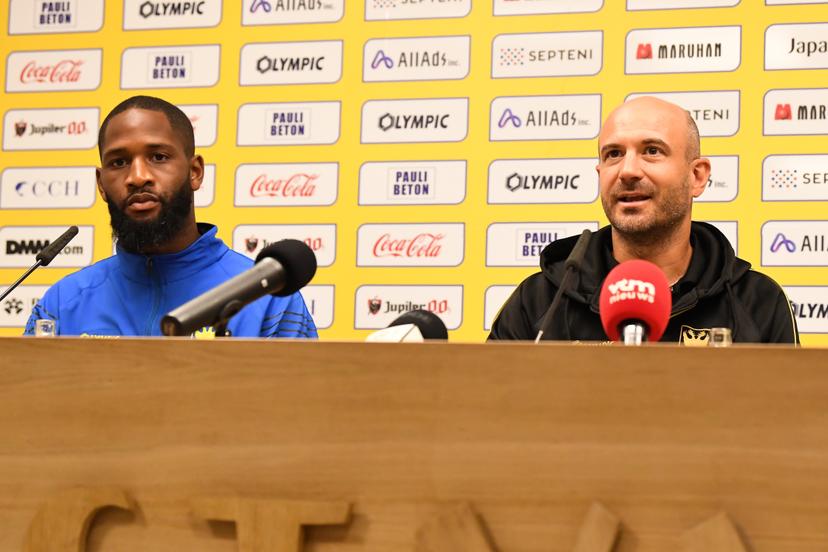 STVV's Abdoulaye Sissako and STVV's head coach Frederic De Meyer pictured during a press conference of Belgian soccer team Sint-Truidense V.V., Wednesday 19 August 2026 in Sint-Truiden, in preparations of the first leg of the play-off round for the UEFA Europa League league phase, against Cypriot team AC Omonoia Nicosia. BELGA PHOTO JILL DELSAUX