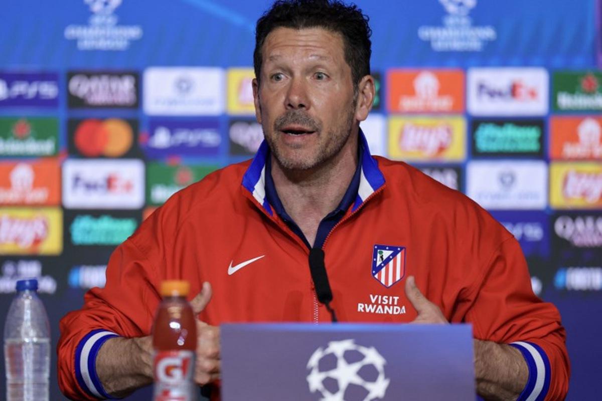 Atletico Madrid's Argentine coach Diego Simeone gives a press conference on the eve of their UEFA Champions League knockout round play-off second leg football match against Club Brugge KV at the Metropolitano Stadium in Madrid on February 23, 2026.  Thomas COEX / AFP