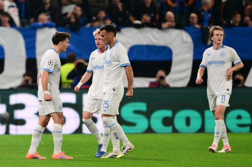 Club Brugge's Greek forward #08 Christos Tzolis (L) celebrates with teammates after scoring his team's first goal during the UEFA Champions League phase day 2 football match between Atalanta and Club Brugge at the Gewiss stadium in Bergamo, on September 30, 2025.   Marco BERTORELLO / AFP