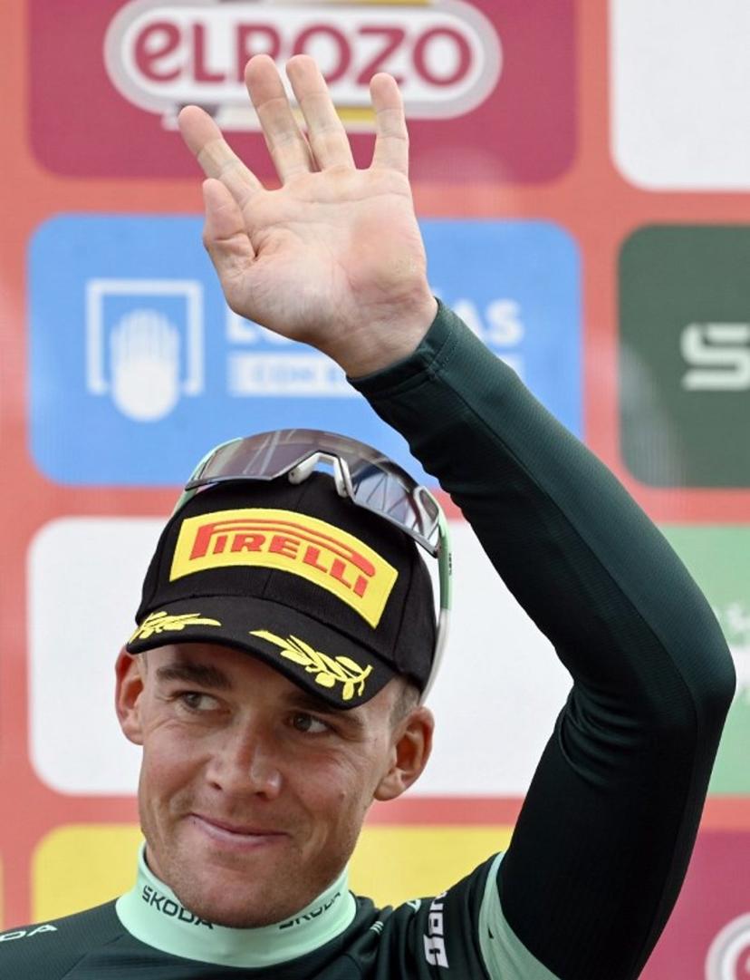 Team Lidl-Trek's Danish rider Mads Pedersen celebrates on the podium wearing the points ranking leader's green jersey after the 14th stage of the Vuelta a Espana cycling tour, a 135 km race between Aviles and La Farrapona in Somiedo, on September 6, 2025.    Miguel RIOPA / AFP