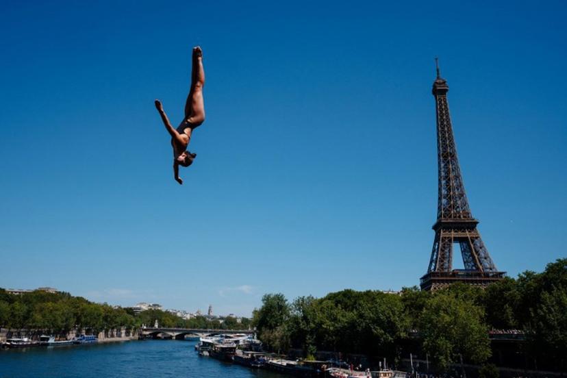 Germany's diver Maike Elena Halbisch competes in round 1 of the women's 20m high diving event during the LEN European Aquatics Championships, alongside the Seine River, with the Eiffel Tower in background, in Paris on August 7, 2026.  Dimitar DILKOFF / AFP