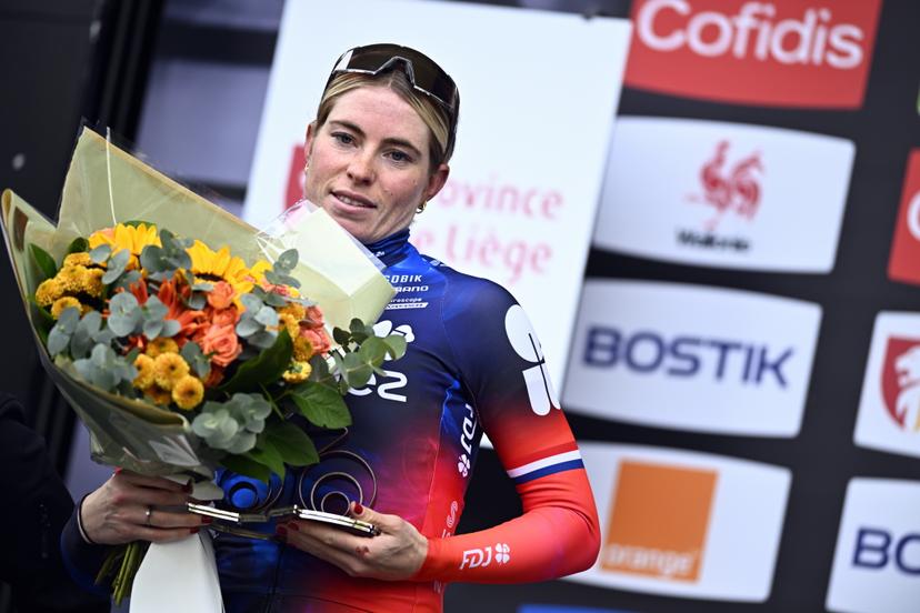 Dutch Demi Vollering of FDJ-Suez celebrates on the podium of the women's race of the 'La Fleche Wallonne', one day cycling race (Waalse Pijl - Walloon Arrow), 140,7 km from Ciney to Huy, Wednesday 23 April 2025. BELGA PHOTO JASPER JACOBS
