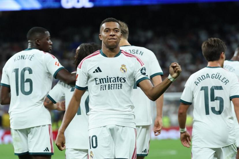Real Madrid's French forward #10 Kylian Mbappe celebrates scoring his team's second goal during the Spanish league football match between Real Madrid CF and Real Sociedad  at Santiago Bernabeu Stadium in Madrid on August 26, 2026.  Thomas COEX / AFP