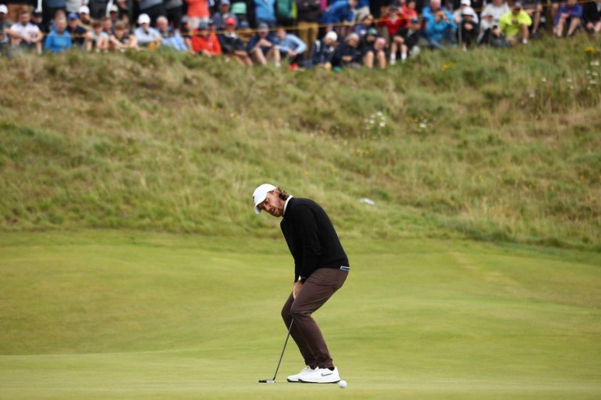 England's Tommy Fleetwood reacts to a missed putt on the 7th green on day two of the 153rd Open Championship at Royal Portrush golf club in Northern Ireland on July 18, 2025.  HENRY NICHOLLS / AFP