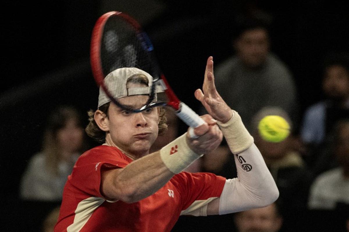 Belgian Zizou Bergs returns the ball to France's Ugo Humbert during their semi-final simple tennis match at the Marseille Open 13 ATP World Tour in Marseille, southern France on February 15, 2025.  MIGUEL MEDINA / AFP