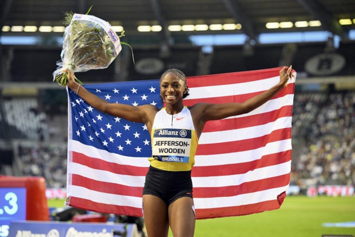 US' Melissa Jefferson-Wooden celebrates after winning the Women's 100m event of the Diamond League athletics meeting at the King Baudouin Stadium in Brussels on August 22, 2025.  JOHN THYS / AFP