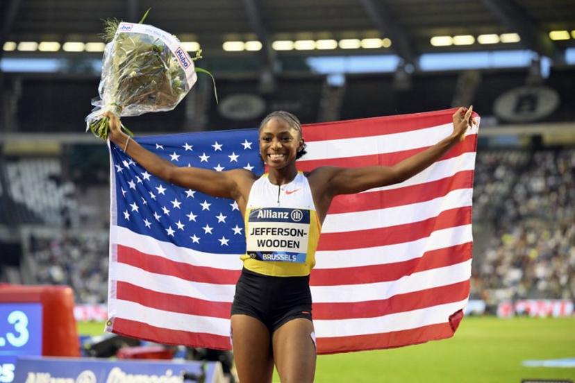 US' Melissa Jefferson-Wooden celebrates after winning the Women's 100m event of the Diamond League athletics meeting at the King Baudouin Stadium in Brussels on August 22, 2025.  JOHN THYS / AFP