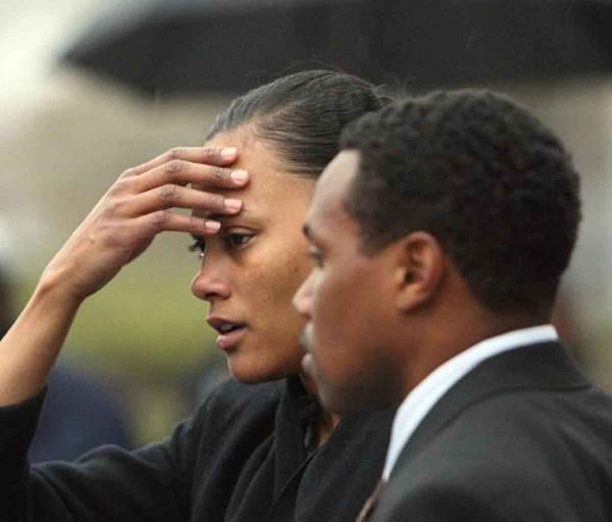 Disgraced former track star Marion Jones leaves Federal Court after sentencing 11 January 2008 in White Plains, New York, accompanied by husband Obadele Thompson (R). Jones was sentenced to six months in prison for lying about taking steroids in a doping scandal that cost the sprinter her Olympic medals. Jones had admitted she lied to federal investigators about being a dope cheat and about her role in a check fraud scheme.    AFP PHOTO/DON EMMERT