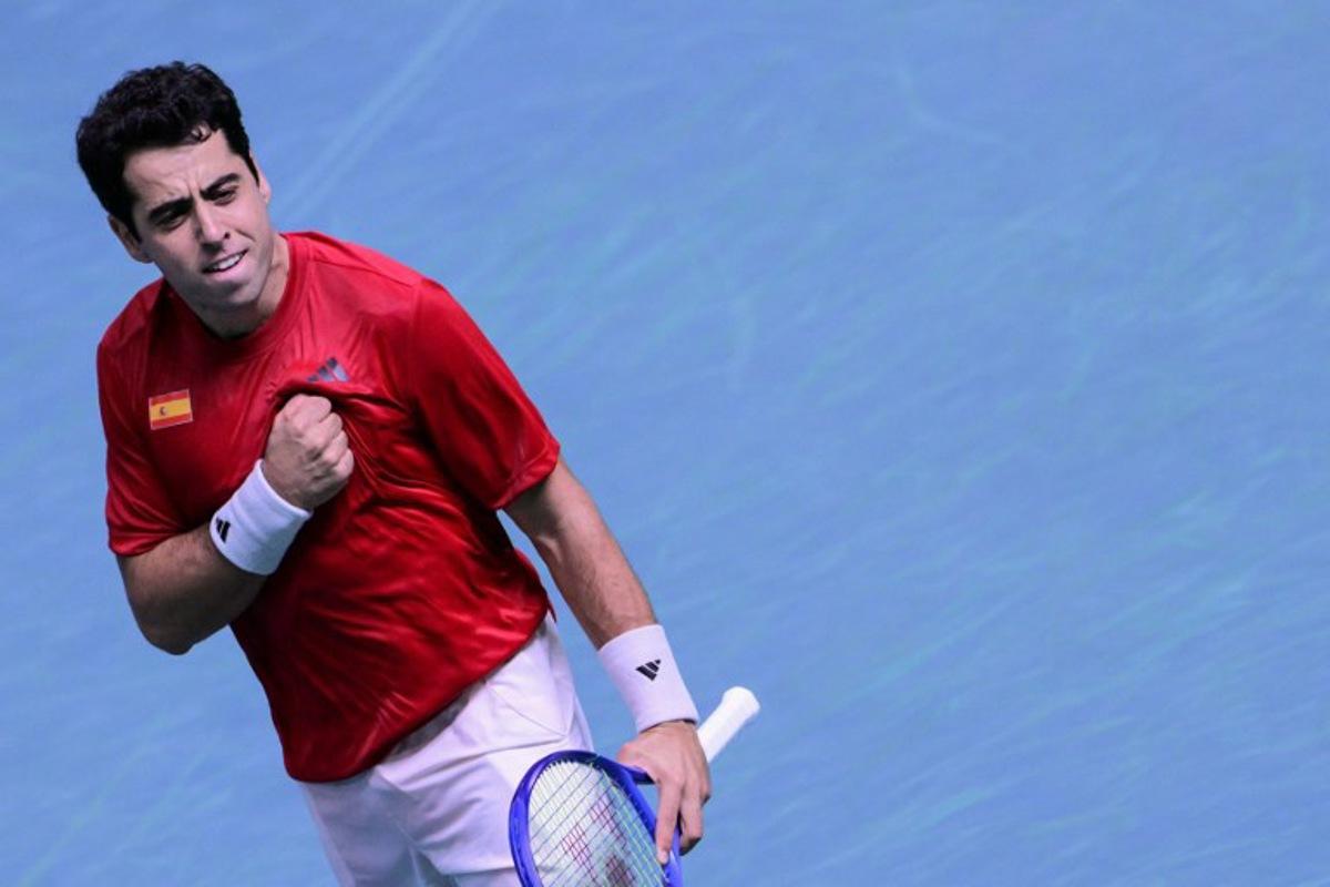 Spain's Jaume Munar Clar celebrates after winning against Czech Republic's Jiri Lehecka during the Davis Cup men's singles quarter finals tennis match, at the Super Tennis Arena, in Bologna, northen Italy, on November 20, 2025.  Tiziana FABI / AFP