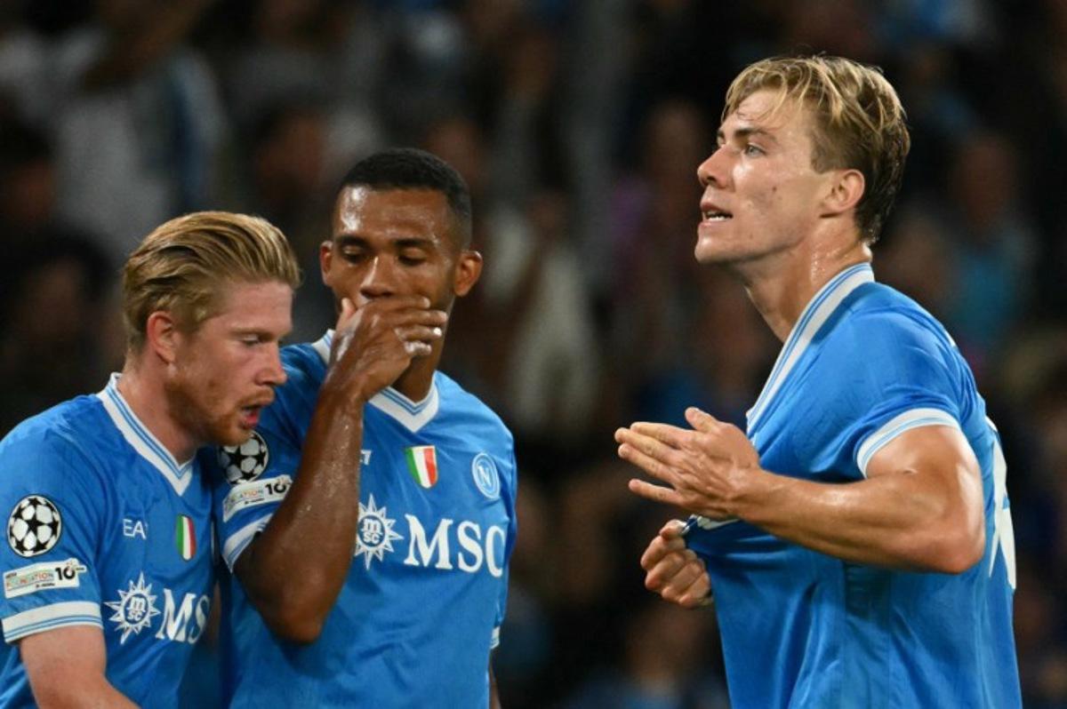 Napoli's Danish forward #19 Rasmus Hojlund celebrates scoring his team's first goal during the UEFA Champions League phase 2 football match Napoli vs Sporting Lisbon at the Diego Armando Maradona stadium in Naples on October 1, 2025.  Alberto PIZZOLI / AFP