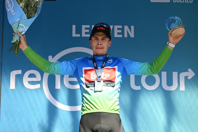 Belgian Arnaud De Lie of Lotto Cycling Team celebrates on the podium in the leader's jersey after winning the fifth and last stage of the 'Renewi Tour' multi-stage cycling race, 185km from and to Leuven on Sunday 24 August 2025. The five-day race takes place in Belgium and the Netherlands.  BELGA PHOTO DAVID PINTENS
