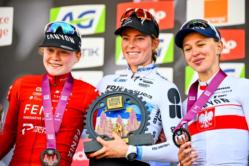 Dutch Puck Pieterse of Fenix-Premier Tech, Dutch Demi Vollering of FDJ United-SUEZ and Polish Katarzyna Niewiadoma-Phinney of CANYON//SRAM Zondacrypto pictured on the podium after the women elite race of the Liege-Bastogne-Liege UCI World Tour one day cycling race, 156km from Bastogne to Liege, Sunday 26 April 2026. BELGA PHOTO ERIC LALMAND
