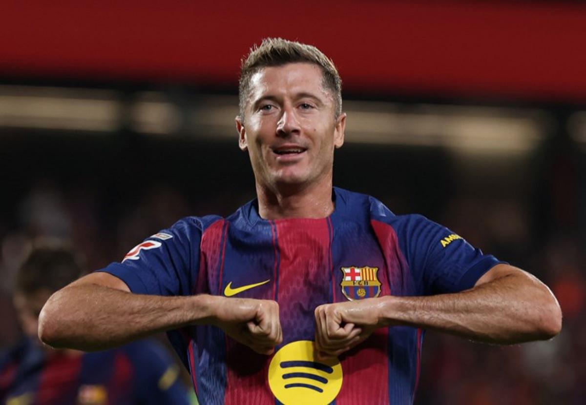 Barcelona's Polish forward #09 Robert Lewandowski celebrates scoring his team's sixth goal during the Spanish league football match between FC Barcelona and Valencia CF at Johan Cruyff Stadium in Barcelona, on September 14, 2025.  Lluis GENE / AFP