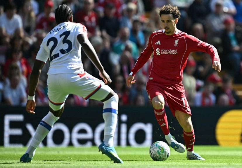 Crystal Palace's French defender #23 Jaydee Canvot (L) defends from Liverpool's English midfielder #17 Curtis Jones during the English Premier League football match between Liverpool and Crystal Palace at Anfield in Liverpool, north west England on April 25, 2026.  Paul ELLIS / AFP