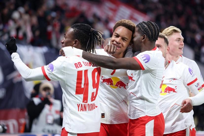 Leipzig's German midfielder #20 Assan Ouedraogo (2L) celebrates scoring his team's first goal with teammates during the German first division Bundesliga football match between RB Leipzig and Werder Bremen in Leipzig on November 23, 2025.  Ronny HARTMANN / AFP
