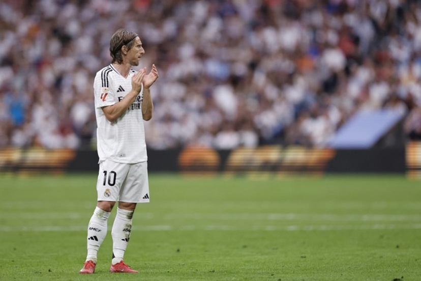 Real Madrid's Croatian midfielder #10 Luka Modric claps during the Spanish league football match between Real Madrid CF and Real Sociedad at Santiago Bernabeu Stadium in Madrid on May 24, 2025.  OSCAR DEL POZO / AFP
