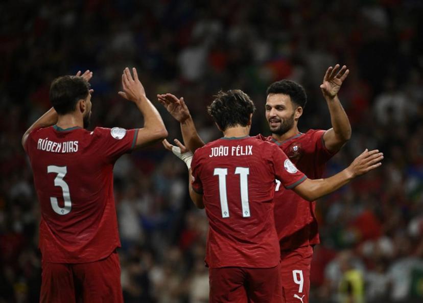 Portugal's forward #09 Goncalo Ramos celebrates with Portugal's forward #11 Joao Felix and Portugal's defender #03 Ruben Dias (L) scoring his team's second goal during the UEFA Nations League Group 4 football match between Portugal and Norway at Dragao stadium in Porto on October 3, 2026  Miguel RIOPA / AFP