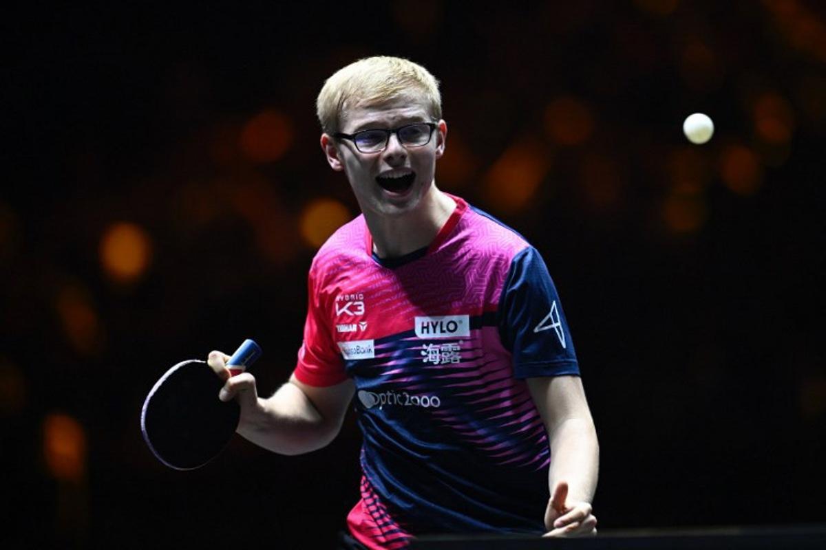 France's Felix Lebrun reacts after a point against China's Wang Chuqin during their men's singles final match at the China Smash Table Tennis 2025 tournament in Beijing on October 5, 2025.  WANG Zhao / AFP