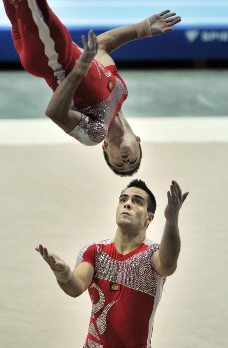 Portugese gymnasts Tiago Figueiredo (above) and Lourenco Franca compete in the acrobatic gymnastics men's pairs competition at the World Games in Kaohsiung on July 21, 2009.  The World Games drew more than 4,700 athletes from across the globe to compete in 31 sports not included in the Olympics. AFP PHOTO/Sam YEH  Sam YEH / AFP