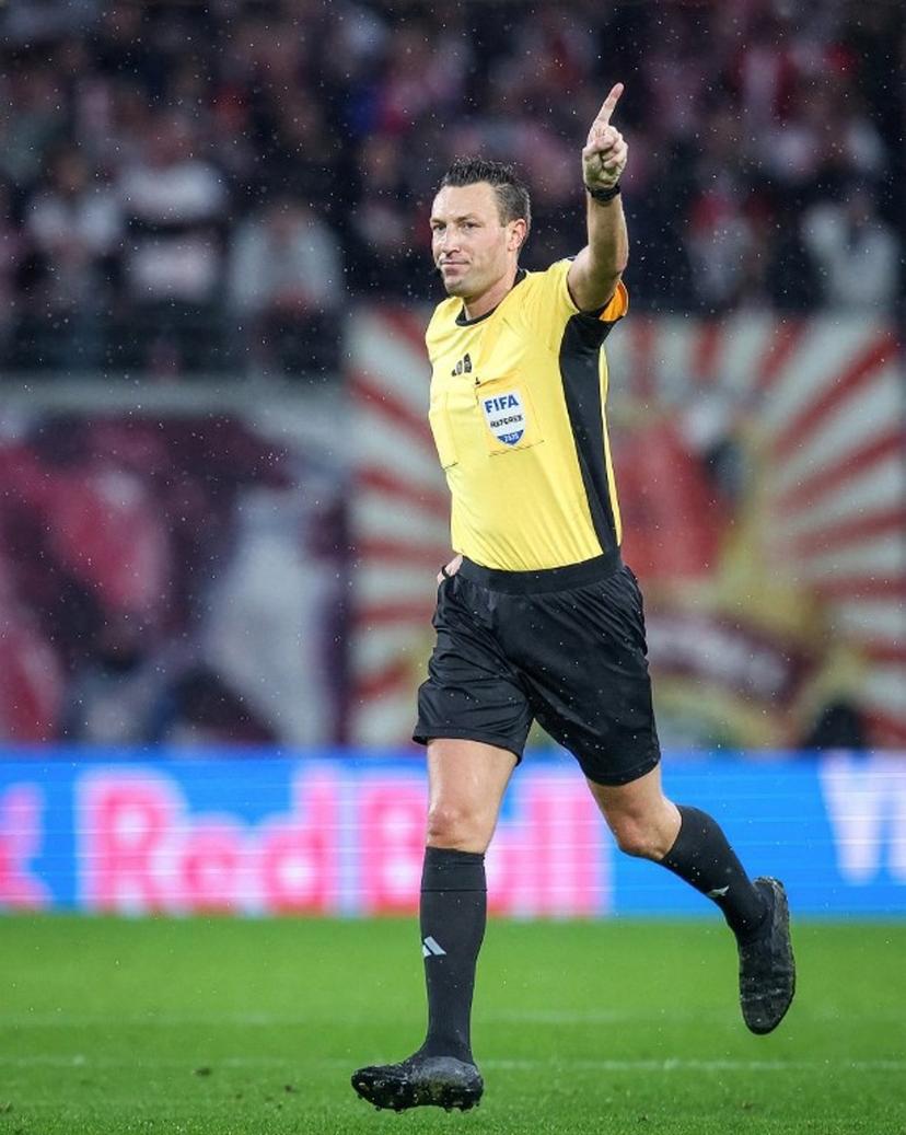 German referee Sven Jablonski gestures during the German first division Bundesliga football match between RB Leipzig and VfB Stuttgart in Leipzig, eastern Germany on November 1, 2025.  RONNY HARTMANN / AFP