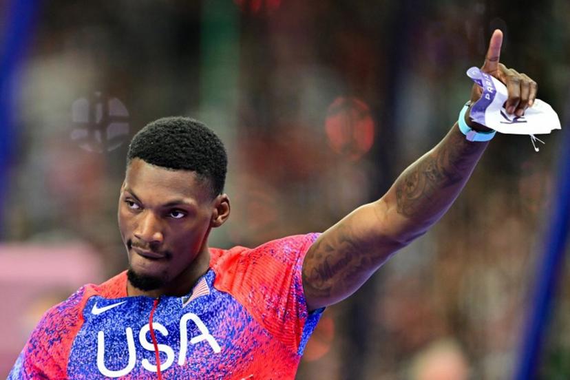 US' bronze medallists Fred Kerley celebrates after the men's 100m final of the athletics event at the Paris 2024 Olympic Games at Stade de France in Saint-Denis, north of Paris, on August 4, 2024.  Martin  BERNETTI / AFP