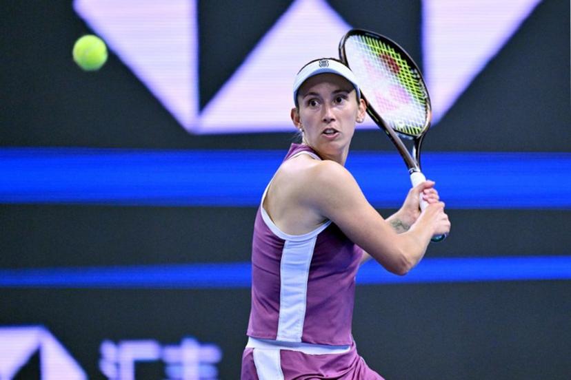 Belgium's Elise Martens hits a return to China's Zheng Qinwen during their women's singles semi-final at the China Open tennis tournament in Beijing on October 10, 2026.  Adek BERRY / AFP