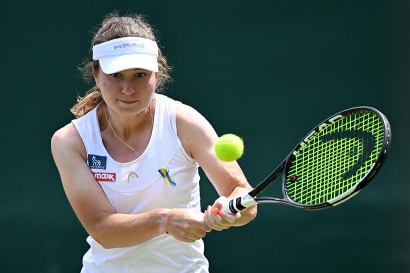 Ukraine's Daria Snigur returns to US player Ashlyn Krueger during their women's singles third round tennis match on the sixth day of the 2026 Wimbledon Championships at The All England Lawn Tennis and Croquet Club in Wimbledon, southwest London, on July 4, 2026.  Kirill KUDRYAVTSEV / AFP