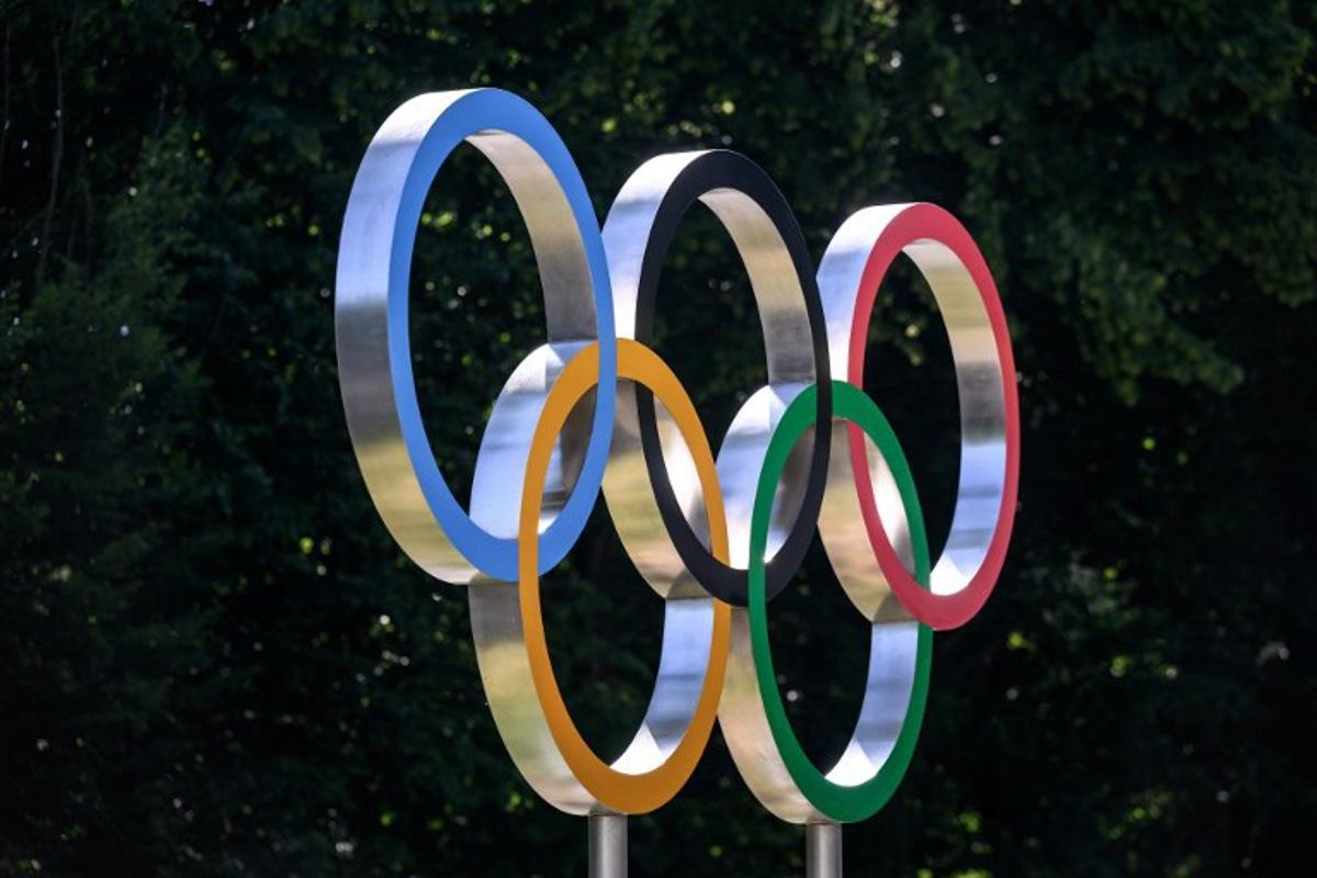 This photograph shows the Olympic rings prior to an IOC executive commission meeting ahead of IOC session, at the Olympic House in Lausanne, on June 22, 2026.  Fabrice COFFRINI / AFP