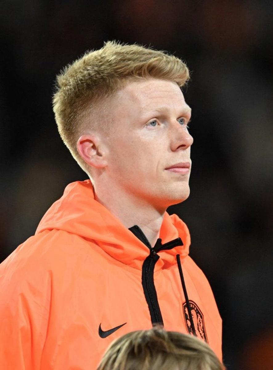 Netherlands' midfielder #16 Jerdy Schouten poses ahead of the friendly international football match between the Netherlands and Ecuador at the PSV Stadium in Eindhoven on March 31, 2026.  JOHN THYS / AFP