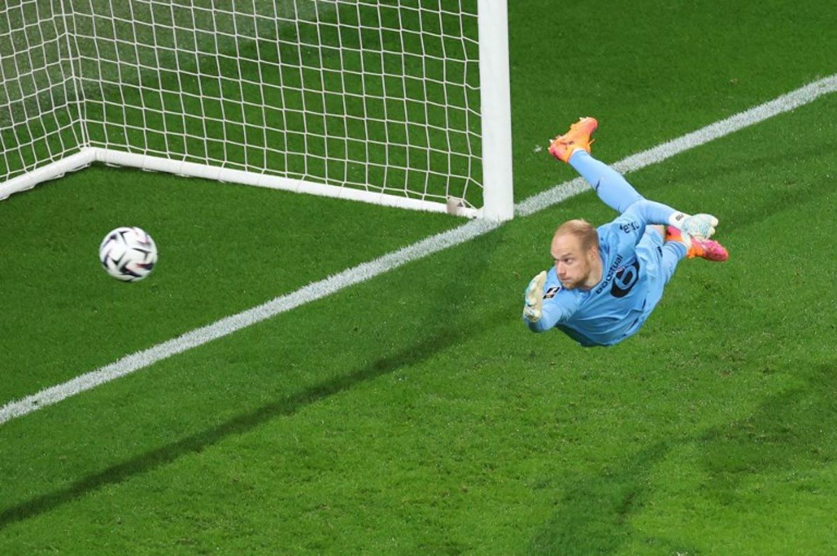 Lille's Belgian goalkeeper #16 Arnaud Bodart dives to make a save during the French L1 football match between OGC Nice and LOSC Lille at the Allianz Riviera stadium in Nice, south-eastern France, on October 29, 2025.  Valery HACHE / AFP