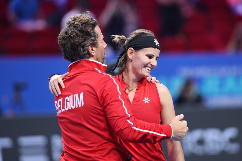 Belgian team captain Wim Fissette and Belgian Greet Minnen celebrate as they won  a tennis match between Ukrainian Svitolina and Belgian Minnnen, the second rubber in the tie between Belgium and Ukraine in the Quarter Finals of the Billie King Cup tournament, on Thursday 24 September 2026 in Shenzhen, China. BELGA PHOTO VIRGINIE LEFOUR