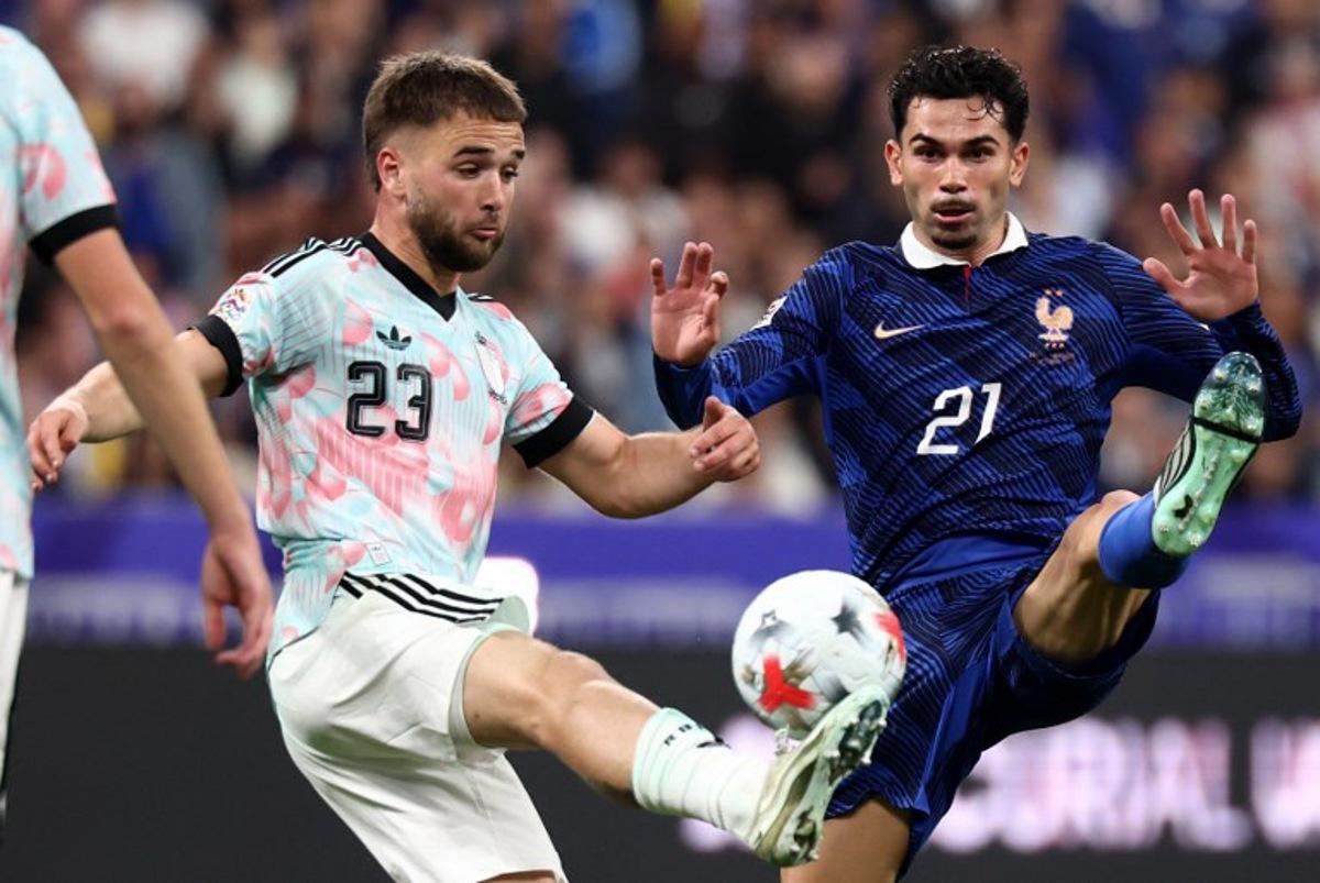 France's midfielder #21 Lucas Da Cunha (R) and Belgium's midfielder #23 Nicolas Raskin fight for the ball during the UEFA Nations League Group A1 football match between France and Belgium at the Stade de France in Saint-Denis, north of Paris, on October 5, 2026.    FRANCK FIFE / AFP