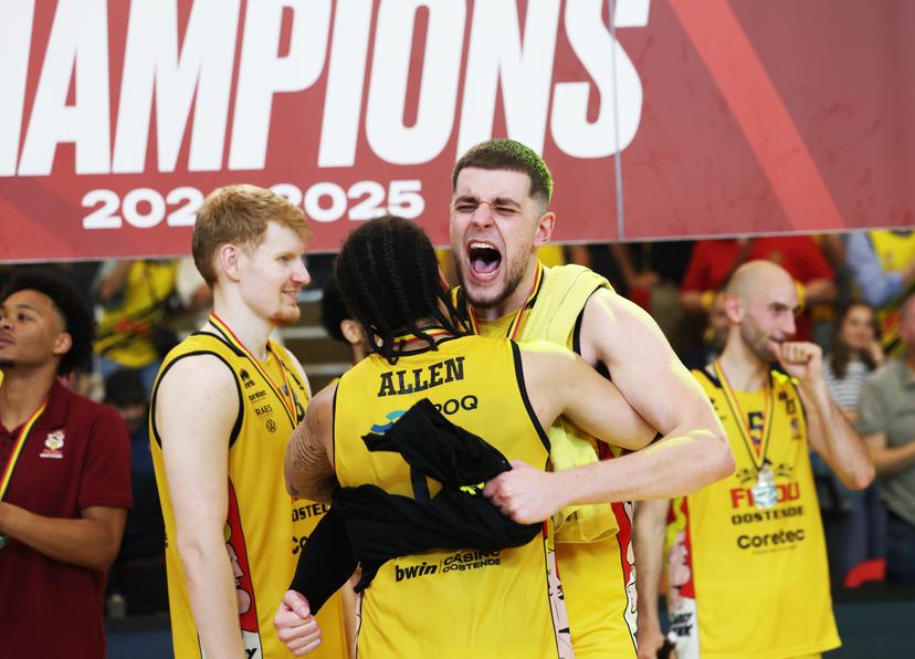 Oostende's Timmy Allen and Oostende's Haris Bratanovic celebrate after winning the Belgian BNXT championship, Saturday 07 June 2025 in Oostende. BC Oostende defeats Kangoeroes Mechelen 100-76 in the fourth game of the best-of-5 finals in the playoffs of the 'BNXT League' Belgian/ Dutch first division basket championship.  BELGA PHOTO KURT DESPLENTER