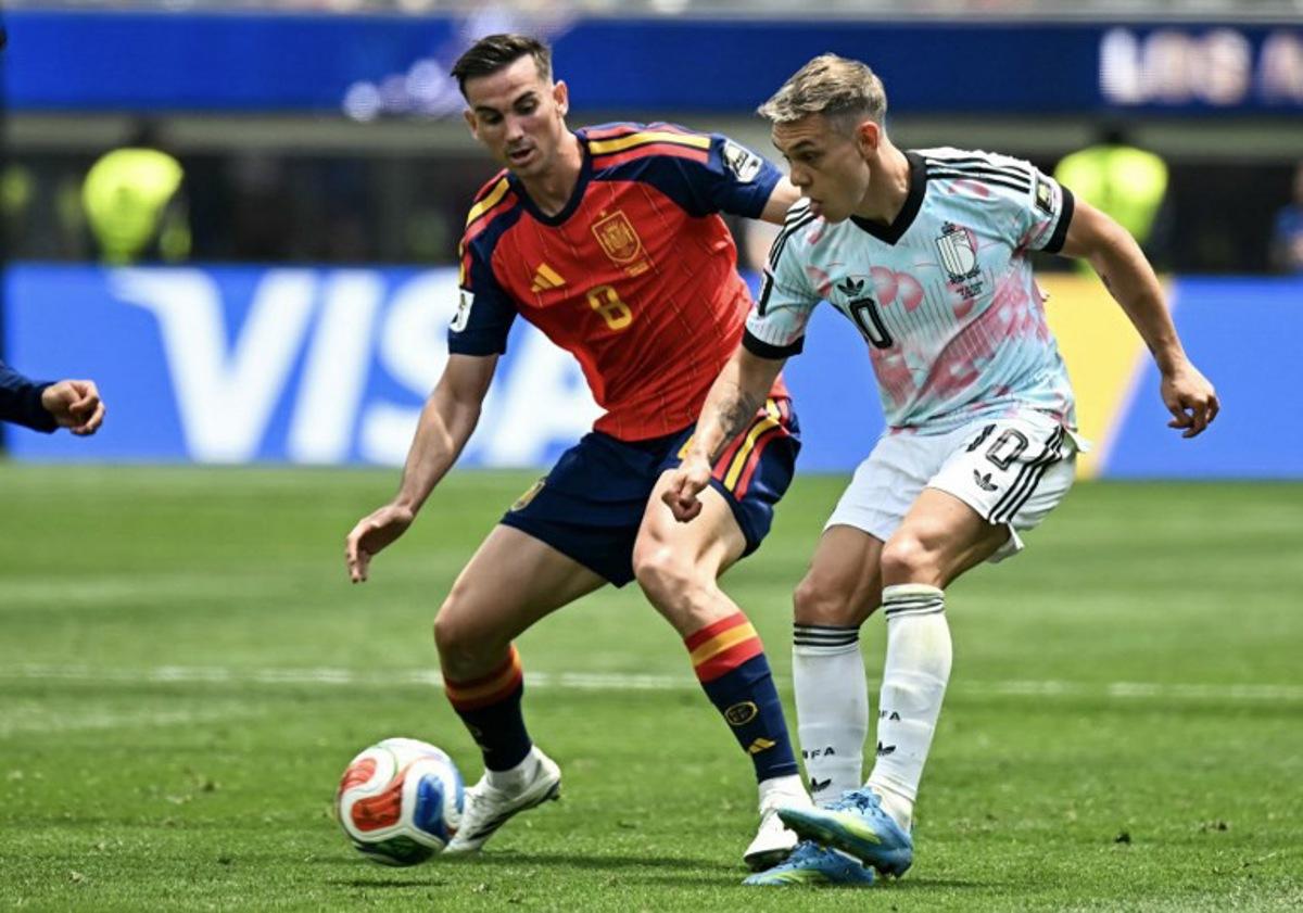 Spain's midfielder #08 Fabian Ruiz and Belgium's forward #10 Leandro Trossard fight for the ball during the 2026 World Cup football tournament quarter-final match between Spain and Belgium at the Los Angeles Stadium in Inglewood on July 10, 2026.   Paul ELLIS / AFP