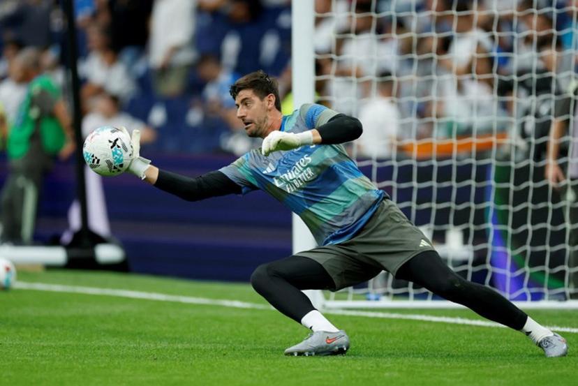 Real Madrid's Belgian goalkeeper #01 Thibaut Courtois warms up prior the Spanish league football match between Real Madrid CF and RCD Espanyol at the Santiago Bernabeu stadium in Madrid on September 20, 2025.  Oscar DEL POZO / AFP
