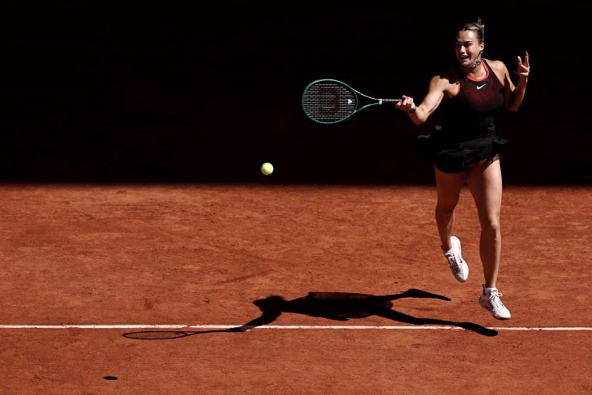 Belarus' Aryna Sabalenka plays a forehand return to Spain's Jessica Bouzas Maneiro during their women's singles match on day 3 of the French Open tennis tournament on Court Philippe-Chatrier at the Roland-Garros Complex in Paris on May 26, 2026.  Anne-Christine POUJOULAT / AFP